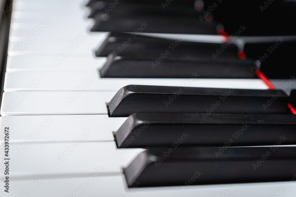Piano keys on classical grand piano - closeup of piano keyboard for pianist, concert, music production and recording concept Piano keys on classical grand piano - closeup of piano keyboard for pianist, concert, music production and recording concept