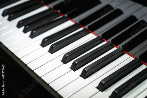 Piano keys on classical grand piano - closeup of piano keyboard for pianist  concert  music production and recording concept