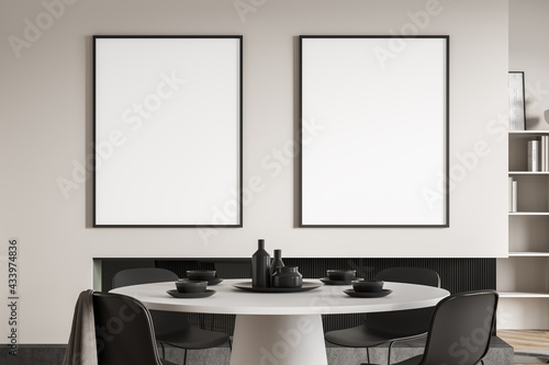 Light dining room interior with minimalist furniture, mockup posters © ImageFlow