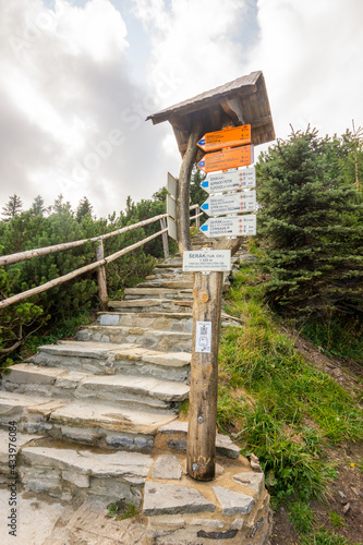 Tourist signpost in the Czech republic mountains Jeseniky on the top of Serak mountain. photo