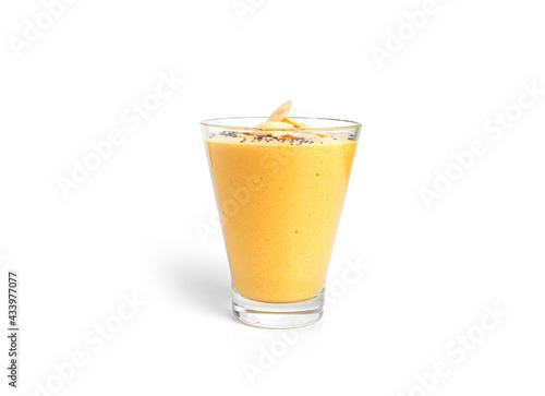 Mango yogurt with chia seeds and almonds isolated on white background.