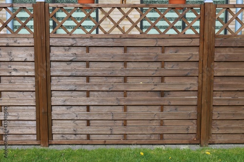 Terrace wooden fence with privacy lattice screen.