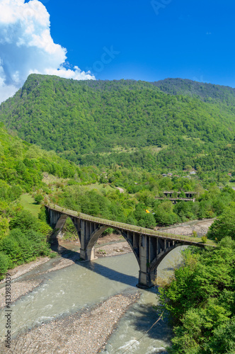 Abkhazia. Abandoned railway bridge over the river Alxga. Attraction of the abandoned city of Tkuarchal (Tkvarcheli).