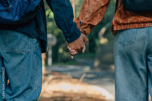 close-up of young couple holding hands