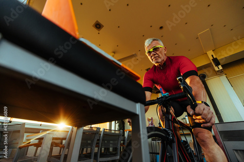 Active senior man at home working out © bernardbodo