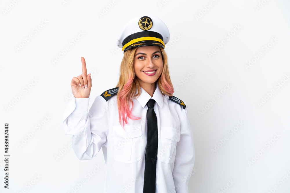 Airplane pilot over isolated white background pointing up a great idea Airplane pilot over isolated white background pointing up a great idea