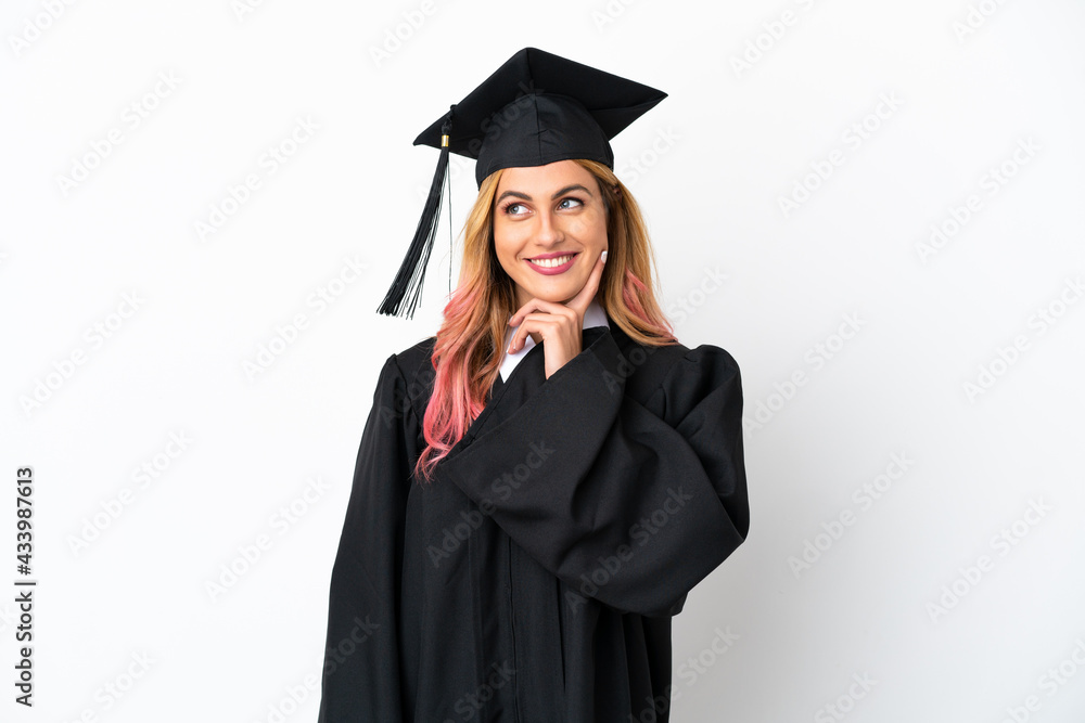 Young university graduate over isolated white background thinking an idea while looking up Young university graduate over isolated white background thinking an idea while looking up