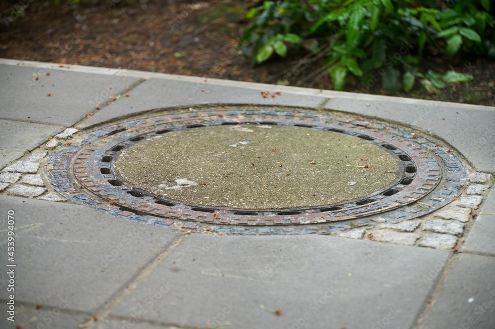 Closeup of a manhole cover outdoors during day