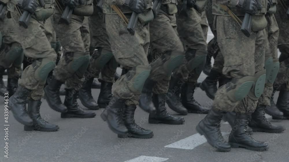 A special forces unit marching through the square. Only the legs are visible in the frame. A special forces unit marching through the square. Only the legs are visible in the frame.