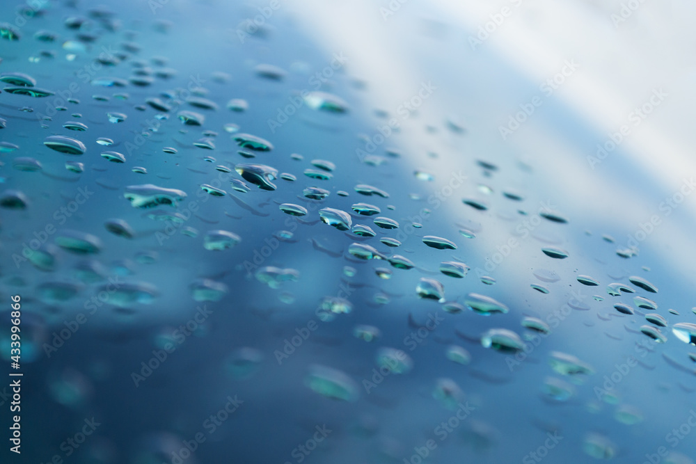 Blurred and focus of rain drop on glass window in monsoon season with blurred building background for abstract and background concept. Blurred and focus of rain drop on glass window in monsoon season with blurred building background for abstract and background concept.