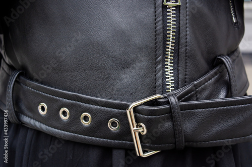 Elements of leather clothing. Black jacket