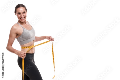 athlete woman on white background with measuring tape