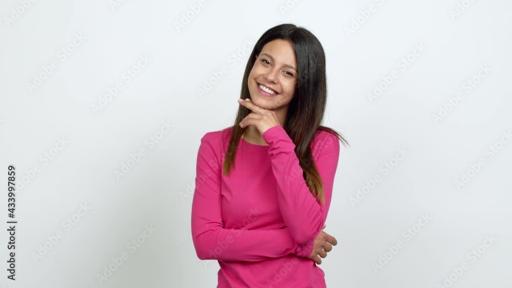 Young woman smiling and looking to the front with confident face over isolated background Young woman smiling and looking to the front with confident face over isolated background