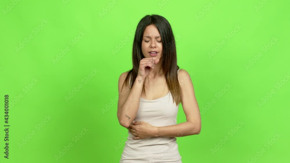 Young woman is suffering with cough and feeling bad over isolated background Young woman is suffering with cough and feeling bad over isolated background