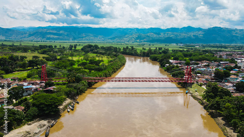 Rio Cauca with Red Bridge in Virginia Colombia photo