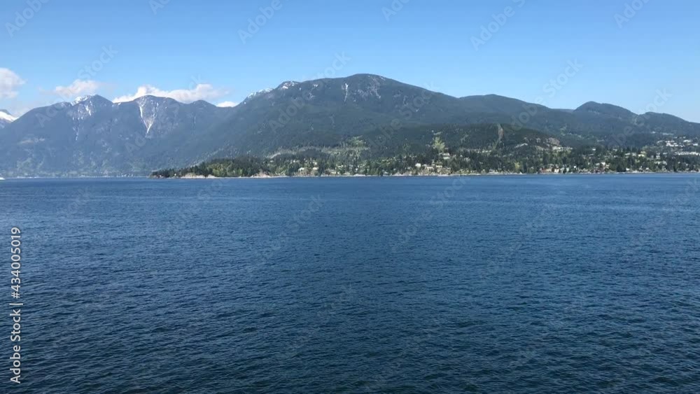 Coastline distancing as boat moving fast in the ocean Coastline distancing as boat moving fast in the ocean