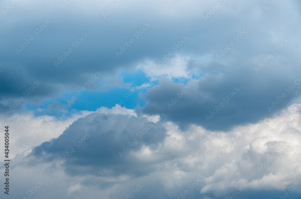 View into impressive spring sky with thick clouds as a texture or background