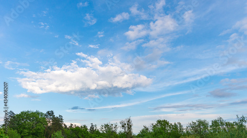 Panoramic view of a blue sky with big cloud on a beautiful spring day