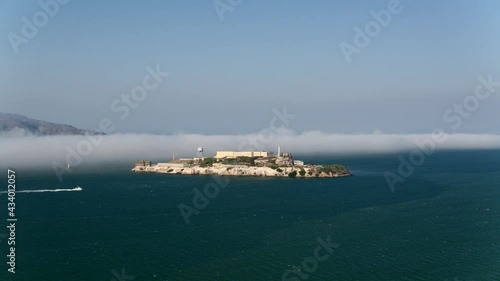 Aerial drone footage of Alcatraz Island an old federal prison that is now part of the Golden Gate National Recreation area - San Francisco, California photo