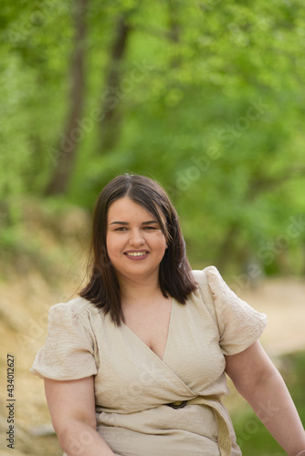 Young girl with a beautiful smile in nature