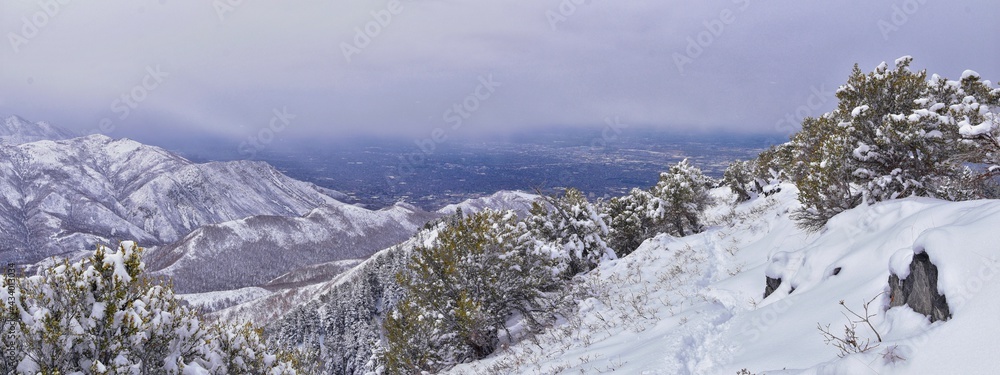 Fototapeta premium Little Black Mountain Peak hiking trail snow views winter via Bonneville Shoreline Trail, Wasatch Front Rocky Mountains, by Salt Lake City, Utah. United States.
