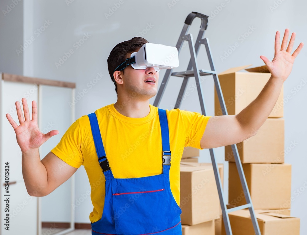Painter contractor working with virtual reality goggles Painter contractor working with virtual reality goggles