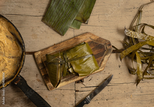 Typical food from Manabi-Ecuador, pork tonga, Latin American food, it is a banana leaf and inside it has pork with peanut sauce. 