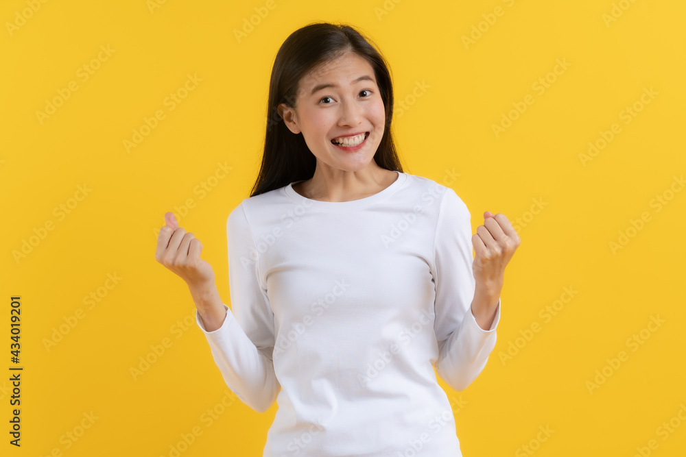 Head shot Beautiful young woman surprised facial expression after seeing shocking, amaze deal in mobile phone isolated on yellow background. Studio shot. banner size. Head shot Beautiful young woman surprised facial expression after seeing shocking, amaze deal in mobile phone isolated on yellow background. Studio shot. banner size.