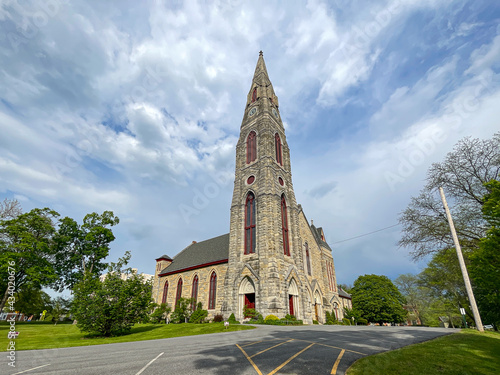 Goshen, NY - USA - May 16, 2021: Landscape view of the First Presbyterian Church. Erected in 1871, it features a three-panel Tiffany window. photo