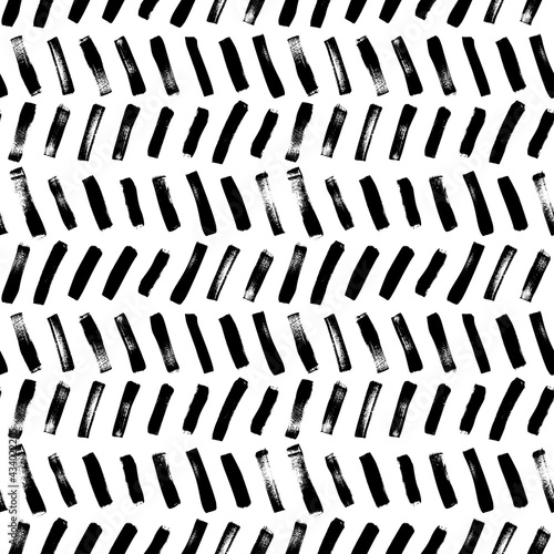 Herringbone brush strokes vector seamless pattern. Chevron texture or wallpaper. Grunge geometric pattern  hand drawn tribal vector background. Graphic diagonal brush strokes  zig zag ink illustration