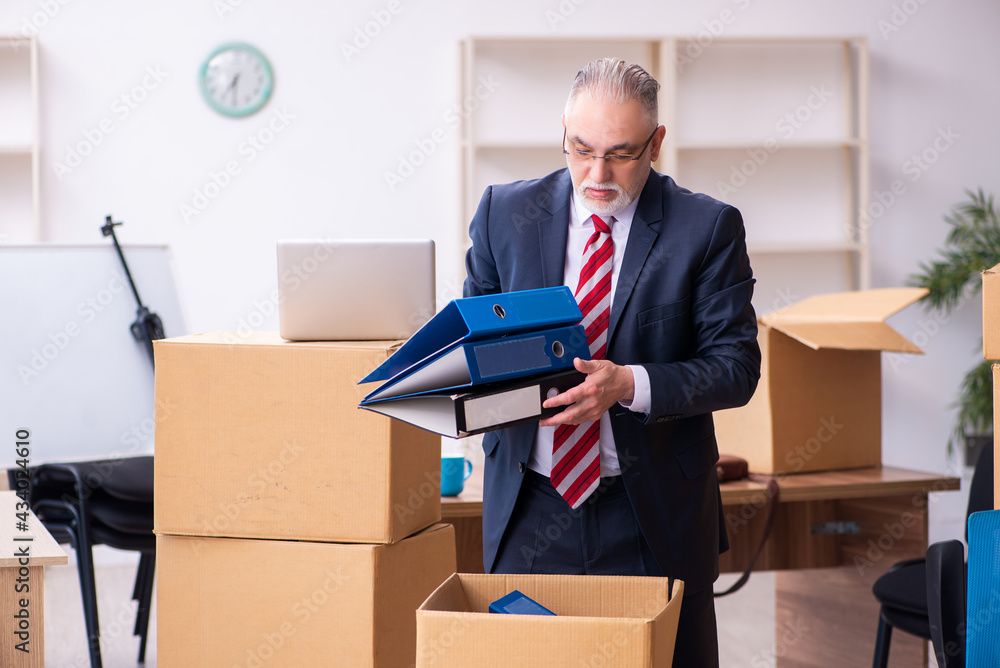 Old businessman employee in relocation concept Old businessman employee in relocation concept