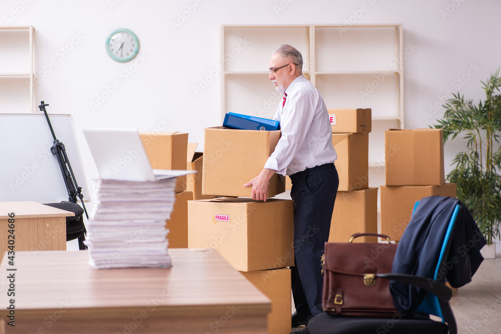 Old businessman employee in relocation concept Old businessman employee in relocation concept