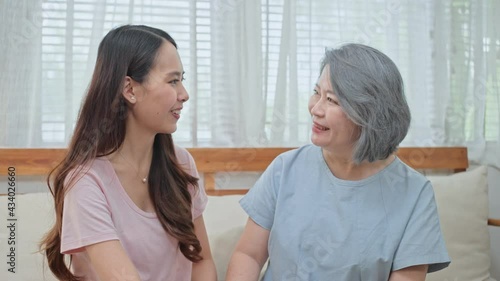 Wallpaper Mural Asian daughter consulting her problem with mother in the living room. Torontodigital.ca