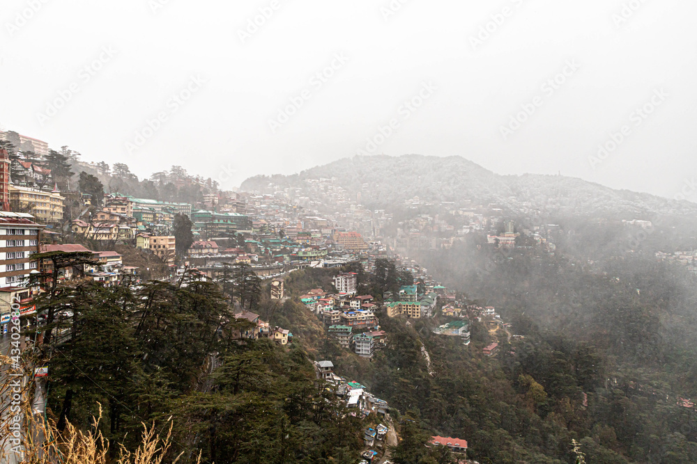 Fototapeta premium beautiful view of shimla city and mall road after snowfall.