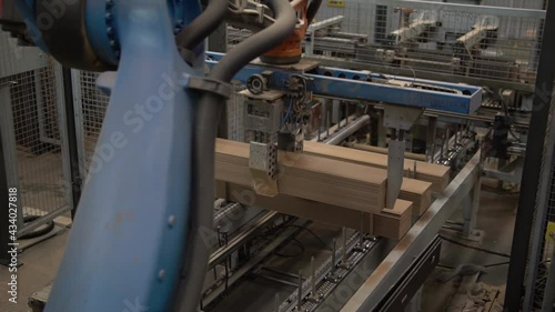 Robotic arm working in parquet factory