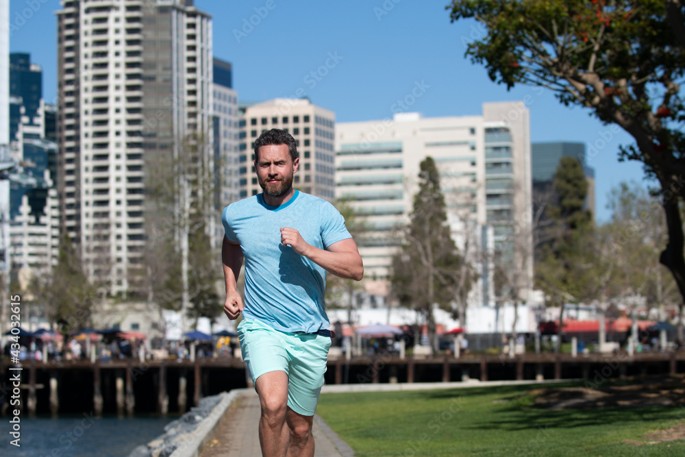 Fitness, workout, sport lifestyle concept. Man running in the city.