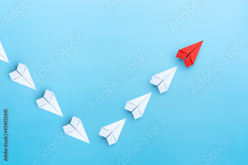 Economic recovery, growth and development with red paper plane flying up