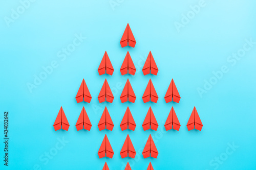 Arrow with red paper planes, Leadership, teamwork and organization concepts