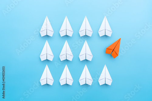 Business concept for new ideas creativity and innovative, solution, with orange paper plane in different way