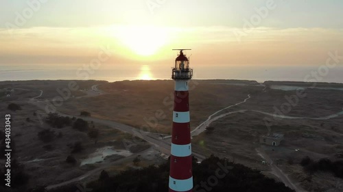 Aerial shot of a lighthouse on the Dutch island Ameland. photo