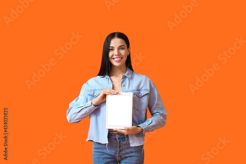 Young woman with tablet com...