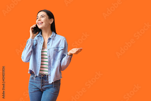 Young woman talking by phon...