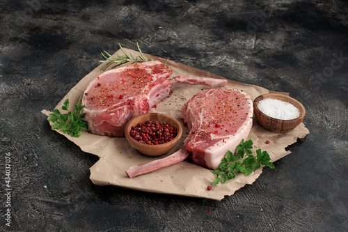 Pork meat with bones on wooden board