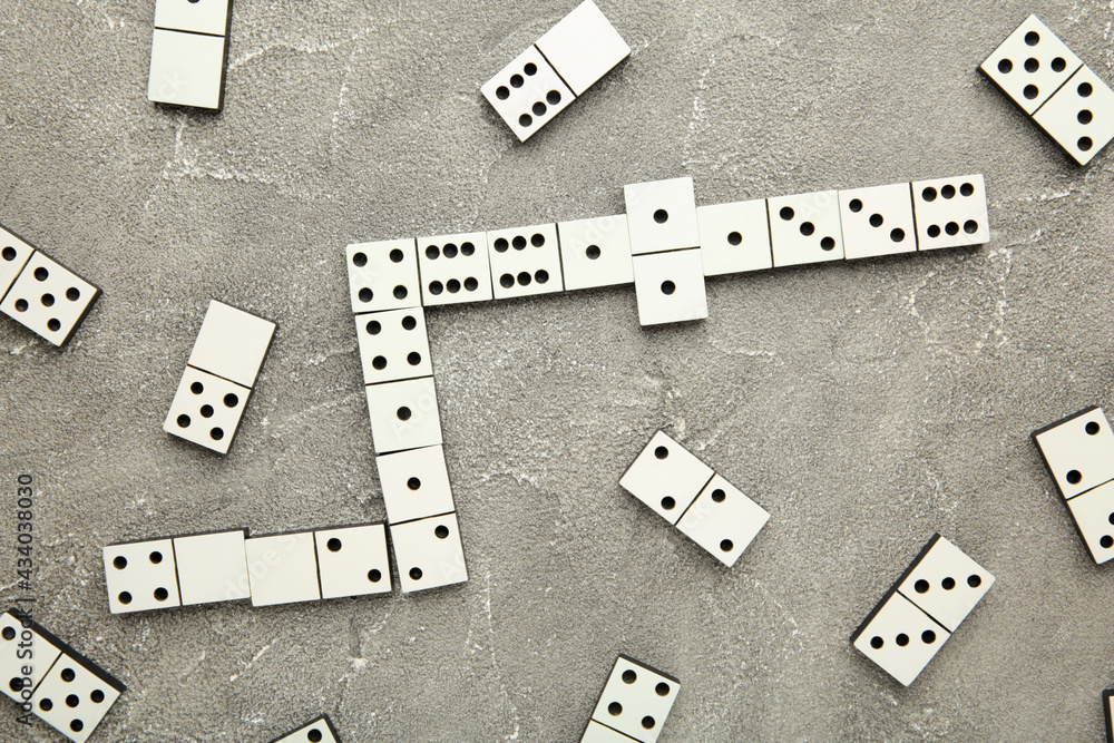 Domino pieces on the grey background. Macro photo Domino pieces on the grey background. Macro photo