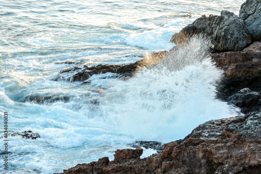 Waves crashing into rock on the coastline