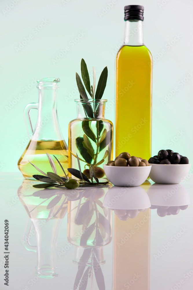 Olive oil bottles, olive branch and Cooking oils Olive oil bottles, olive branch and Cooking oils