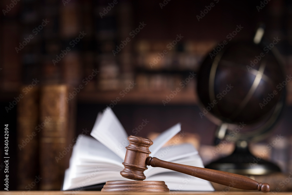 Law and justice concept, wooden gavel, globe background Law and justice concept, wooden gavel, globe background