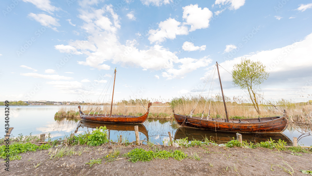 Boats on river at beautiful summer sunrise Boats on river at beautiful summer sunrise
