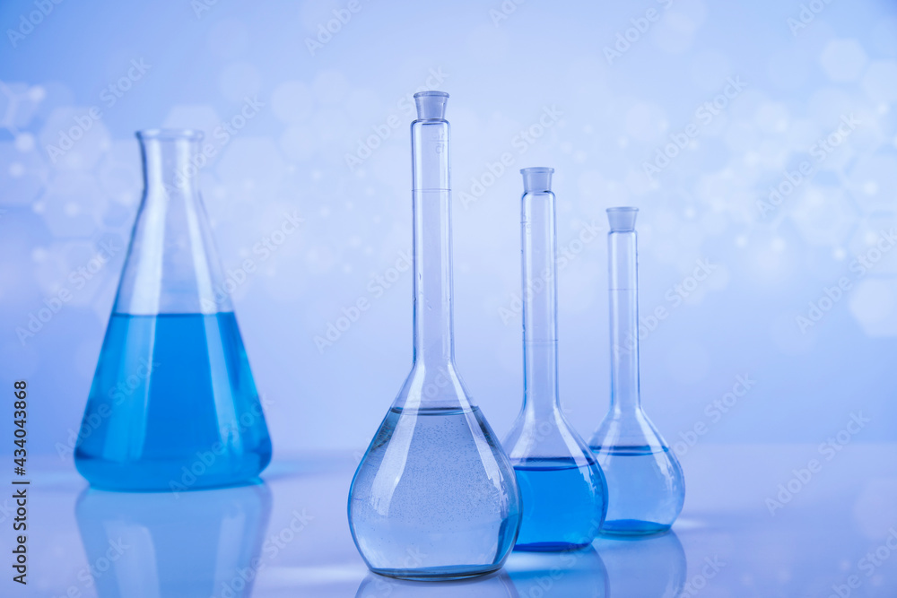 Laboratory beakers,Science experiment, blue background Laboratory beakers,Science experiment, blue background