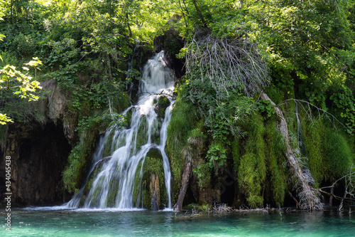 Waterfall with turquoise water in the Plitvice Lakes National Park  Croatia.